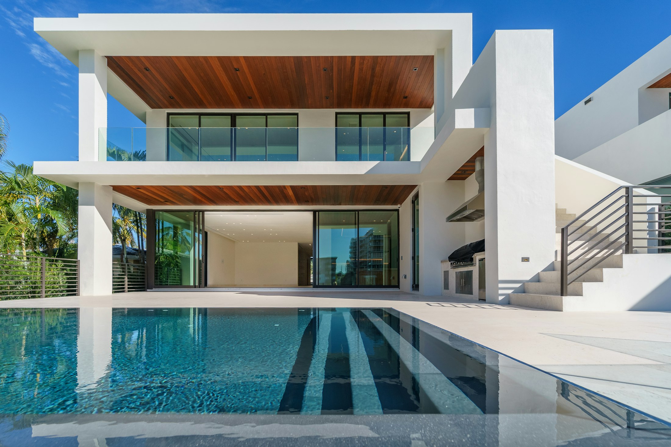 Modern villa with infinity pool at dusk